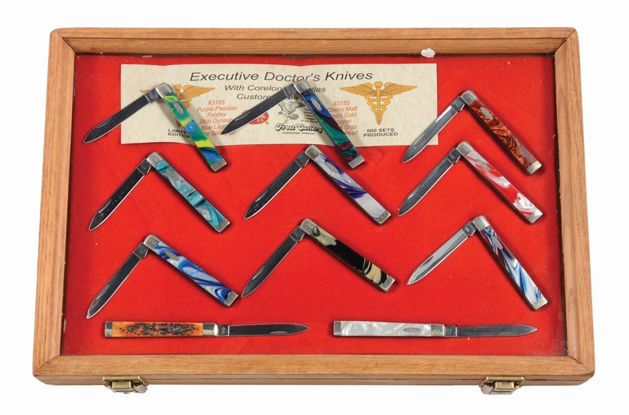 LOT OF 11: CASE FOLDING DOCTORS KNIVES COMPLETE WITH WOOD AND GLASS LOCKING DISPLAY CASE.