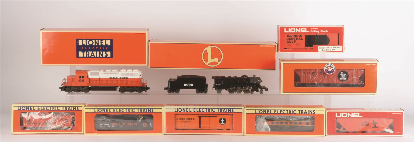 LOT OF 18: MOSTLY LIONEL ILLINOIS CENTRAL LOCOMOTIVES & ROLLING STOCK.