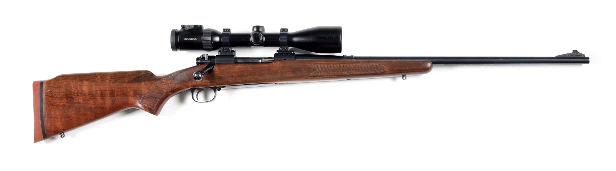 (C) WINCHESTER MODEL 70 BOLT-ACTION RIFLE WITH SWAROVSKI SCOPE.