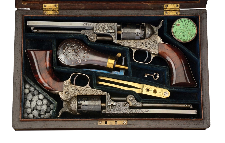 (A) RARE CASED PAIR OF ENGRAVED COLT MODEL 1849 POCKET PERCUSSION REVOLVERS.