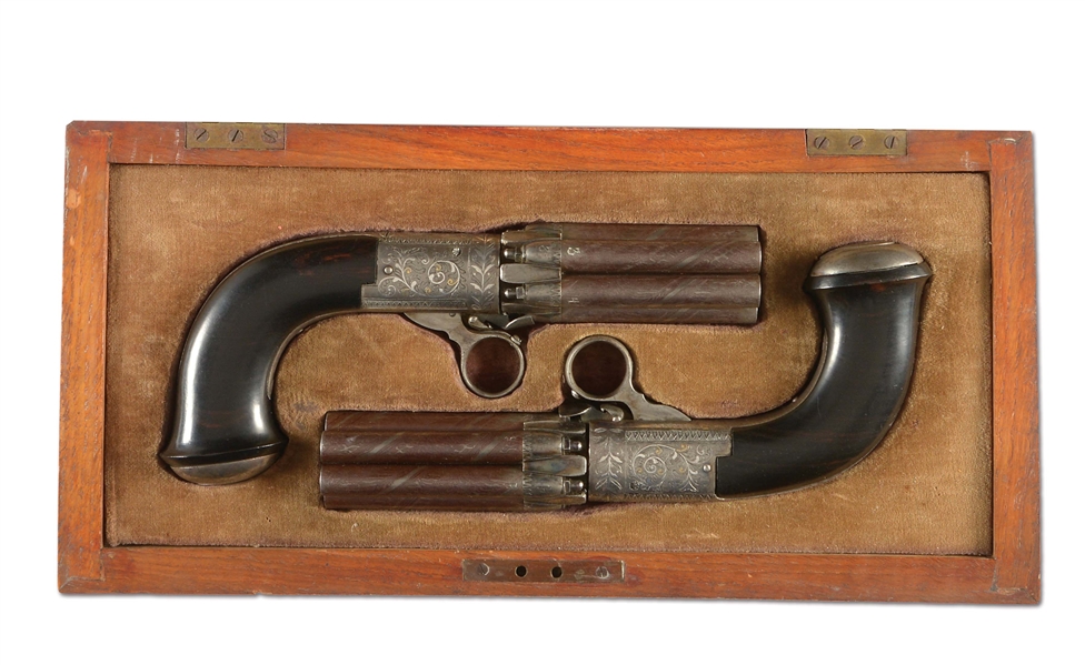 (A) A VERY FINE CASED SET OF SILVER AND GOLD INLAID CONTINENTAL UNDERHAMMER PERCUSSION PEPPERBOXES WITH EBONY GRIPS.