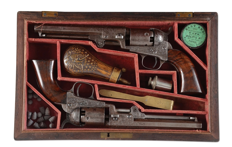 (A) DUAL CASED PAIR OF COLT GUSTAVE YOUNG ENGRAVED 1849 POCKET REVOLVERS.