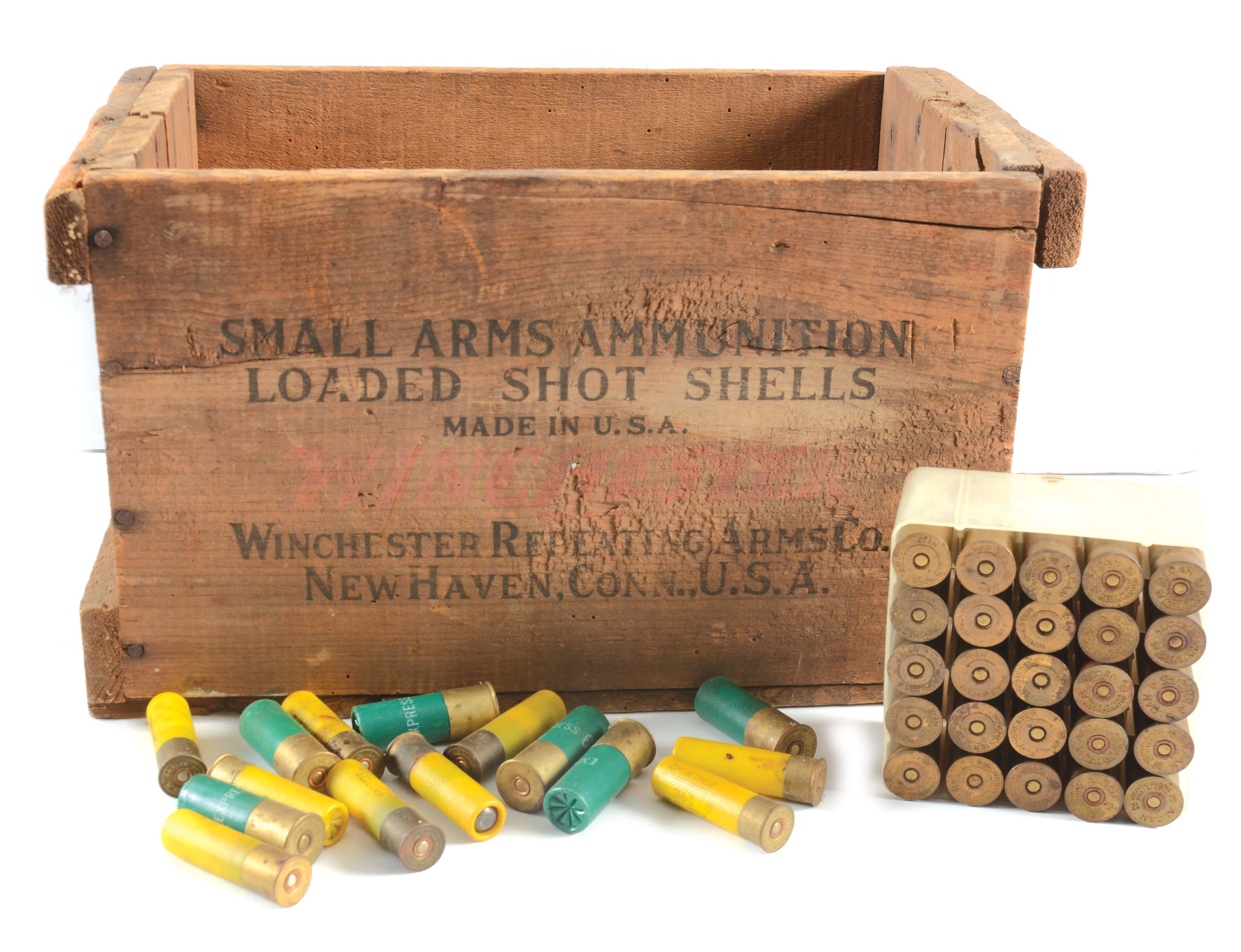 Lot of several shotgun shells in wooden crate. 