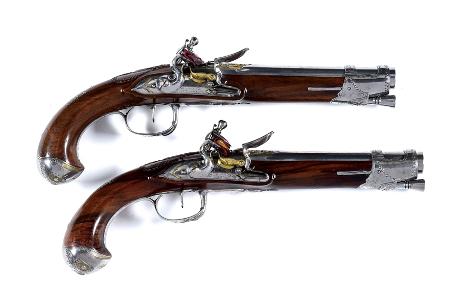 (A) A RARE AND SUPERB PAIR OF FRENCH FLINTLOCK OFFICERS PISTOLS BY GUILLIERON OF ST. ETIENNE, CIRCA 1815 WITH RELIEF CHISELED AND GILT STEEL MOUNTS.