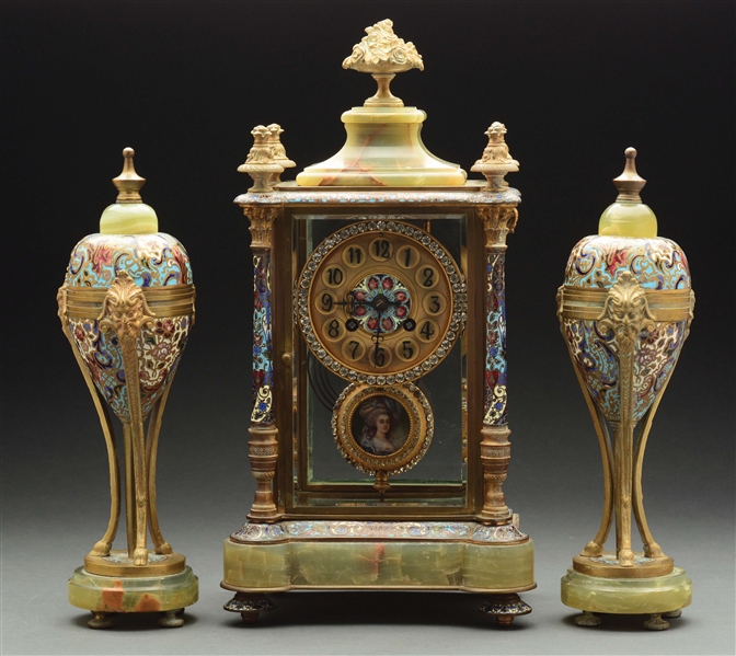 FRENCH ONYX AND CHAMPLEVE THREE PIECE CLOCK SET. 