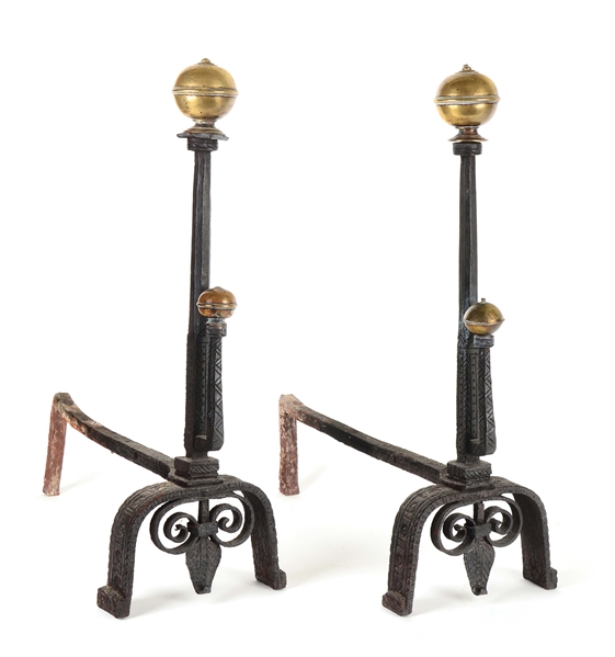 PAIR OF VERY EARLY WROUGHT IRON AND BRASS TRIMMED ANDIRONS IN THE WILLIAM AND MARY STYLE. PROBABLY ENGLISH. CIRCA 1690.