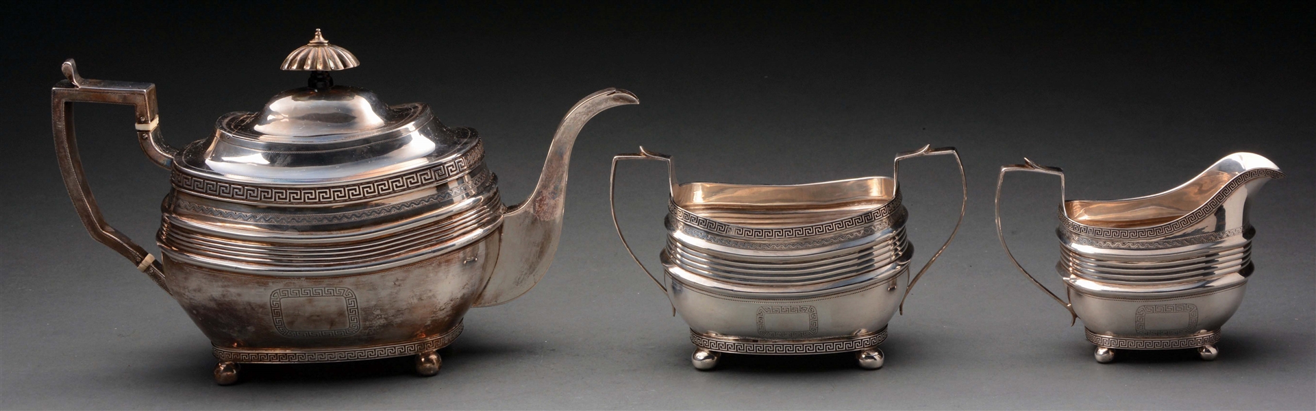 STERLING SILVER TEAPOT, CREAM AND SUGAR.