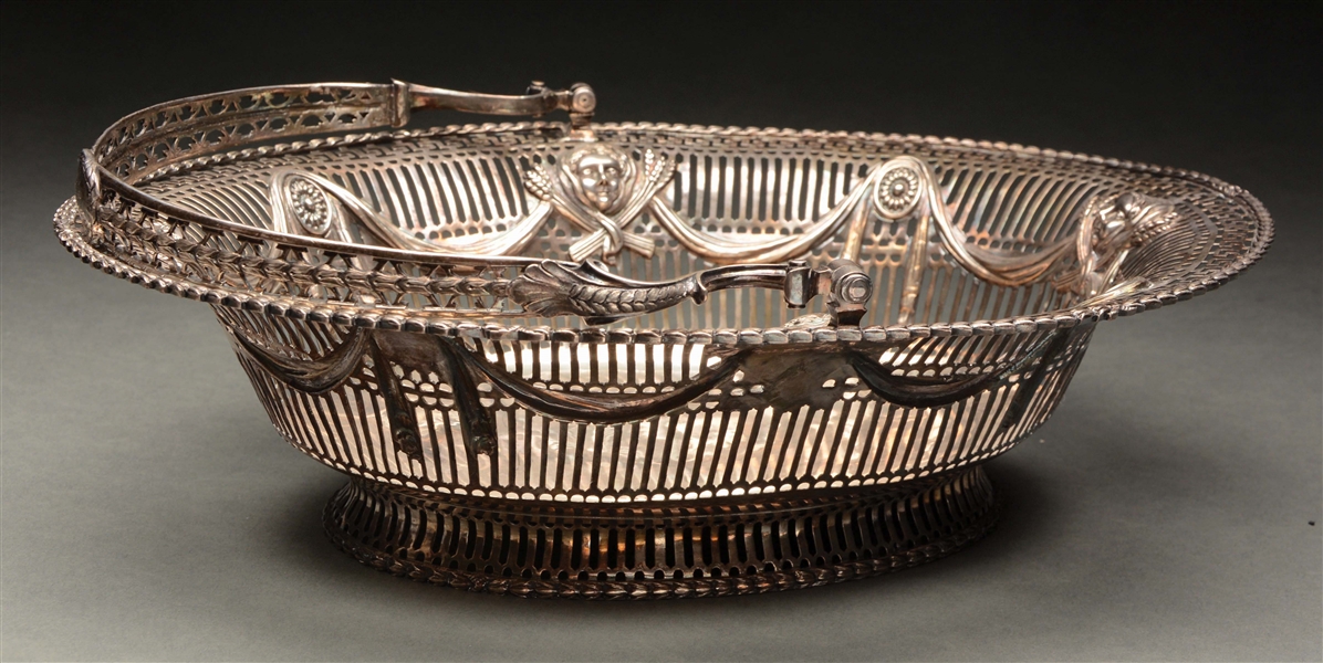 AN IMPRESSIVE ENGLISH SILVER WIRE BREADBASKET WITH HANDLE.