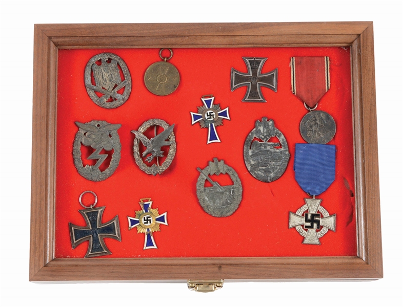 LOT OF 12: GERMAN WORLD WAR II AWARDS AND COMBAT BADGES.