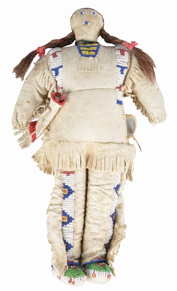 SIOUX INDIAN BUCKSKIN DOLL HOLDING PIPE.