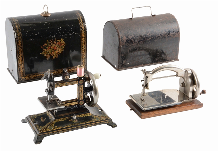 LOT OF 2: SEWING MACHINES WITH COVERS.