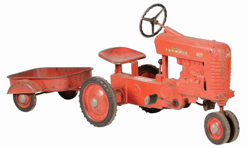 MCCORMICK FARMALL PEDAL TRACTOR WITH TRAILER.