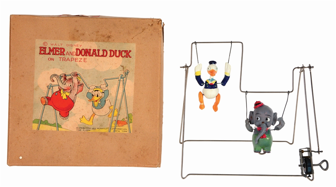 EXCEEDINGLY RARE JAPANESE TIN AND CELLULOID WALT DISNEY ELMER AND DONALD DUCK ON TRAPEZE TOY IN ORIGINAL BOX.