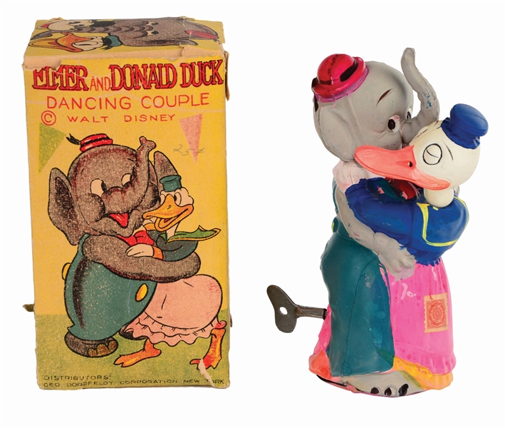 VERY RARE PRE-WAR TIN AND CELLULOID WIND-UP WALT DISNEY ELMER ELEPHANT AND DONALD DUCK DANCING COUPLE TOY.