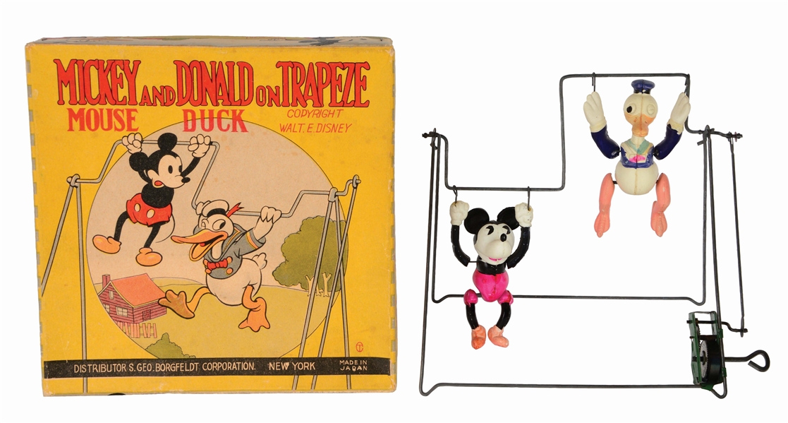 SCARCE JAPANESE CELLULOID AND TIN WALT DISNEY MICKEY MOUSE AND DONALD DUCK ON TRAPEZE TOY.