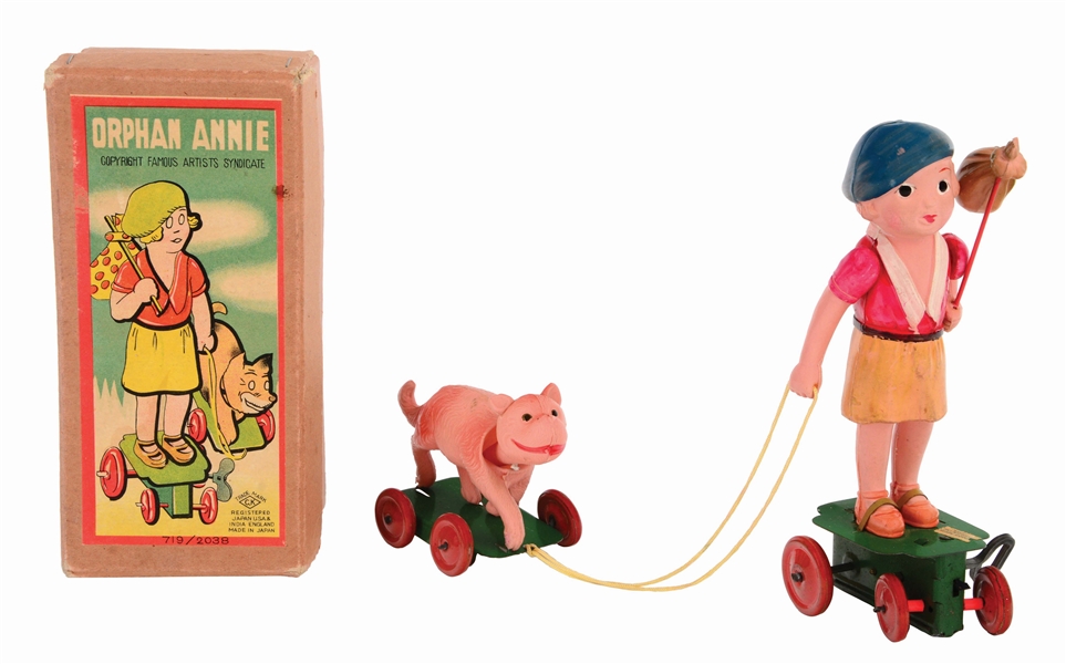 JAPANESE TIN-LITHO AND CELLULOID WIND-UP ORPHAN ANNIE TOY WITH SCARCE ORIGINAL BOX.
