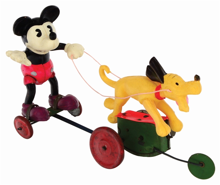 JAPANESE TIN-LITHO AND CELLULOID WIND-UP WALT DISNEY MICKEY MOUSE BEING PULLED BY PLUTO FIGURE.