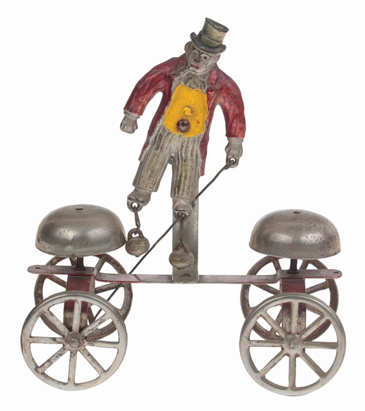 ATTRIBUTED TO WATROS CAST IRON AND SHEET METAL LITTLE NEMO BELL TOY.