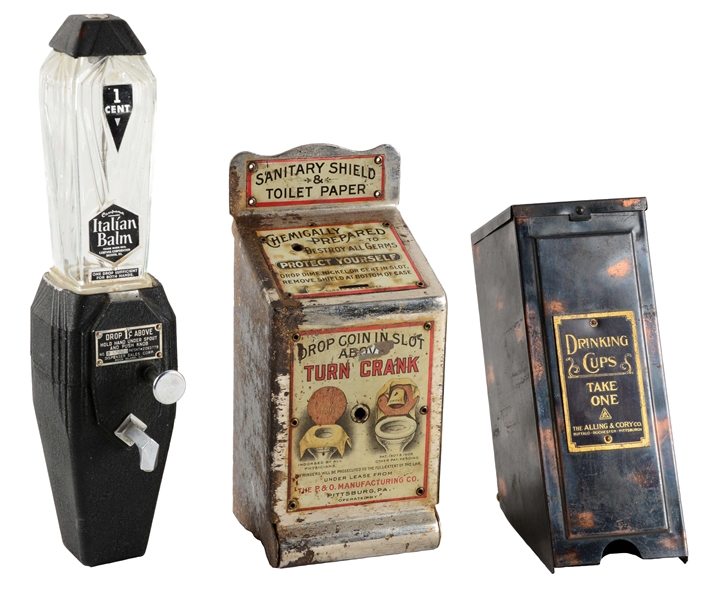 LOT OF 3: VENDING MACHINES, TOILET SHIELD AND LOTION VENDORS WITH A DRINKING CUP DISPENSER.