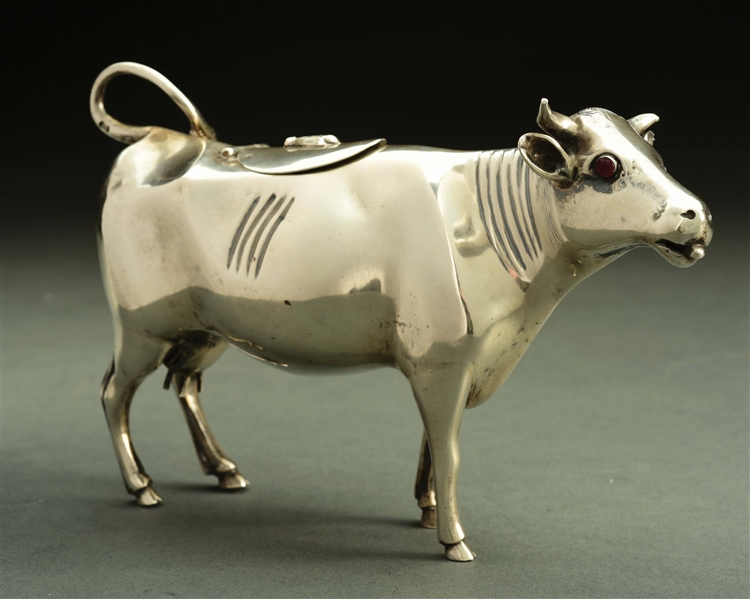 A LARGE SILVER COW CREAMER.