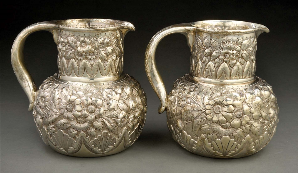 A MATCHED PAIR OF WHITING STERLING WATER PITCHERS.