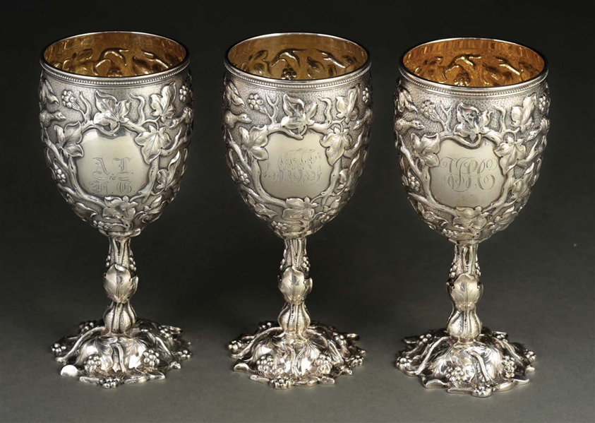 A SET OF THREE TIFFANY STERLING GOBLETS.