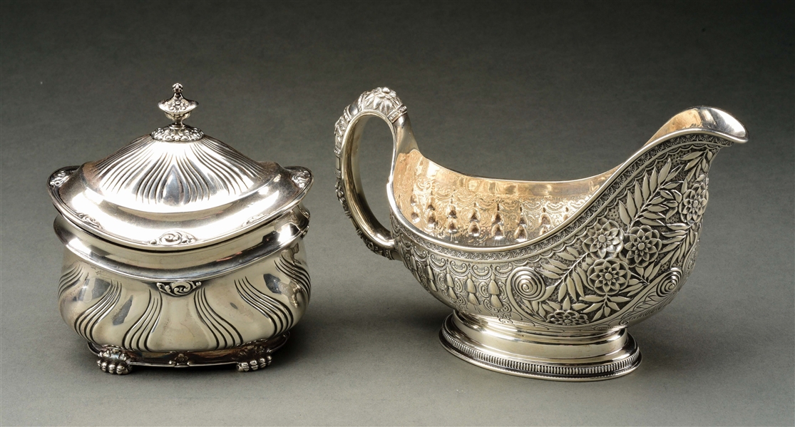 A TIFFANY STERLING TEA CADDY AND A GRAVY BOAT.
