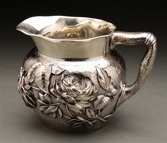 AN AMERICAN STERLING WATER PITCHER.