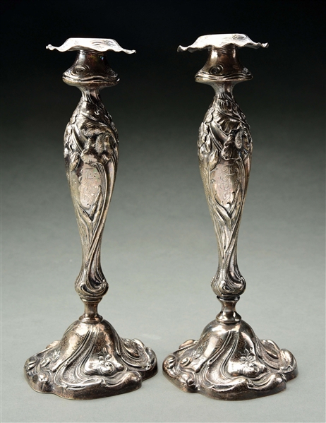 A PAIR OF AMERICAN STERLING WEIGHTED CANDLESTICKS.