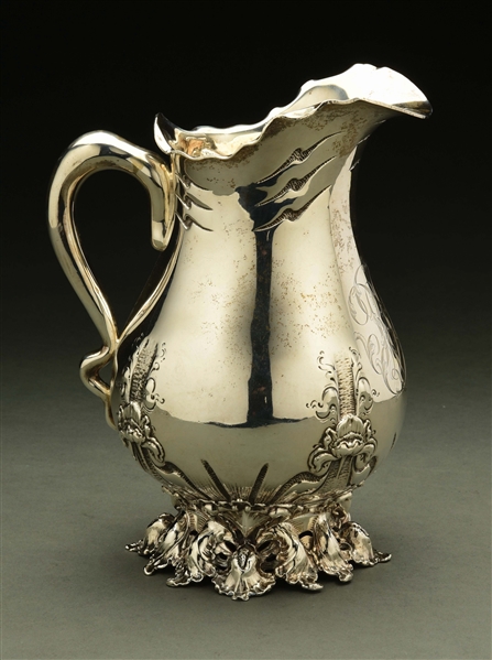 AN AMERICAN STERLING WATER PITCHER.