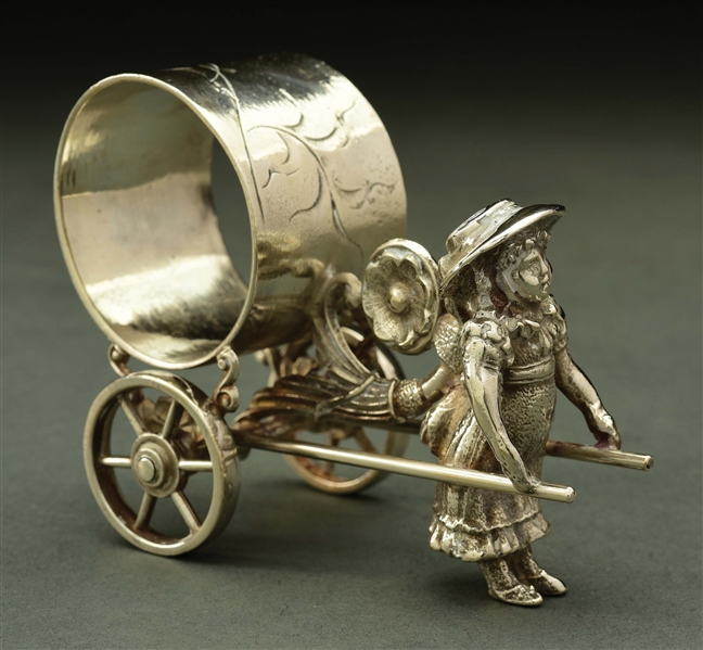 GIRL WITH CART FIGURAL NAPKIN RING.