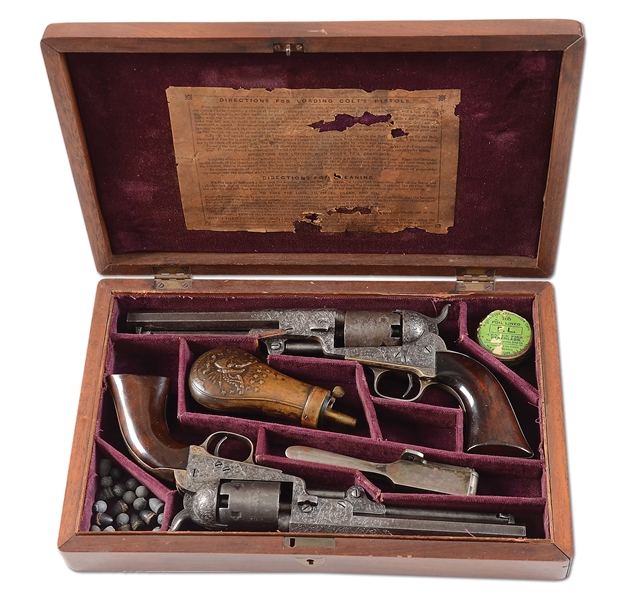 (A) CASED PAIR OF ENGRAVED COLT 1849 POCKET PERCUSSION REVOLVERS.