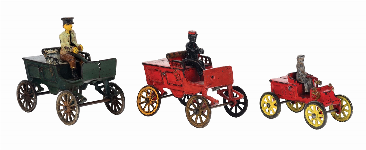 LOT OF THREE CAST IRON HORSELESS CARRIAGES.