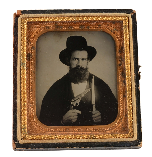 AMBROTYPE OF MAN HOLDING BELL KNIFE AND COLT PISTOL.