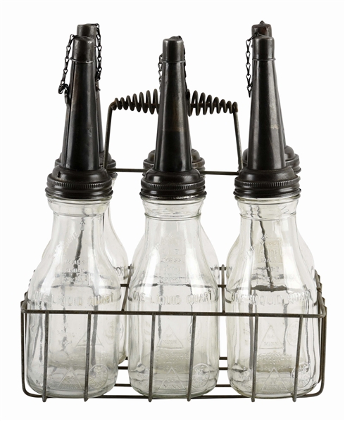 SET OF SIX SERVICE STATION GLASS OIL BOTTLES W/ METAL CARRYING RACK. 