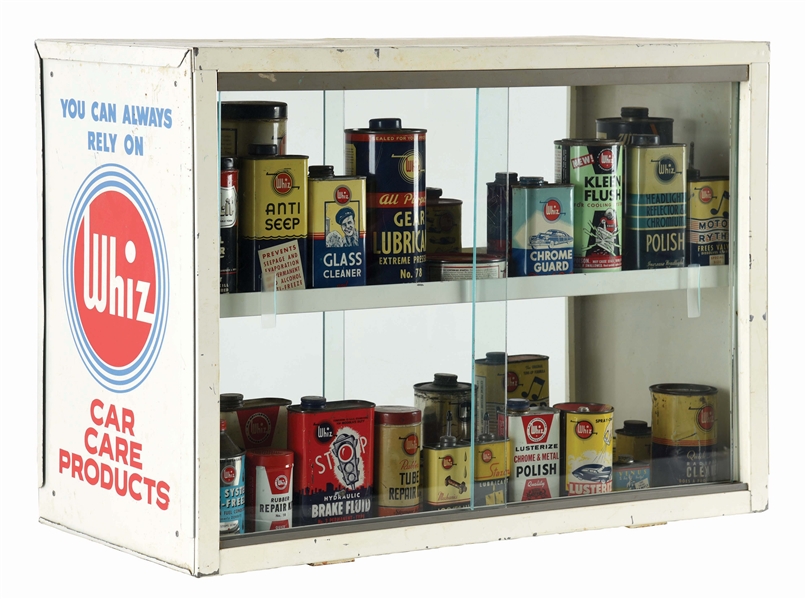 WHIZ CAR CARE PRODUCTS GLASS FACE CABINET W/ THIRTY FIVE VARIOUS WHIZ AUTOMOTIVE PRODUCTS CANS. 