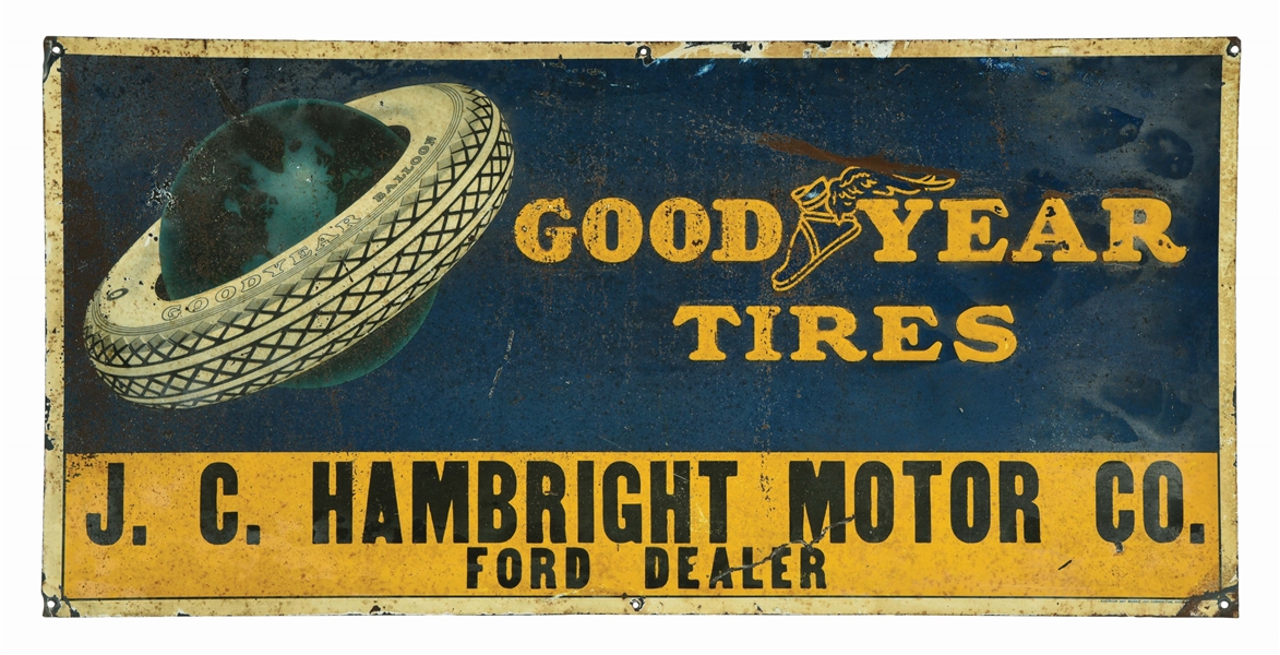 GOODYEAR TIRES EMBOSSED TIN SIGN W/ TIRE & GLOBE GRAPHIC. 