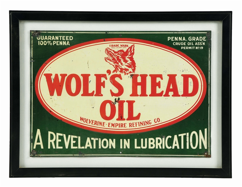 WOLFS HEAD MOTOR OIL EMBOSSED TIN SIGN W/ ADDED FRAME. 