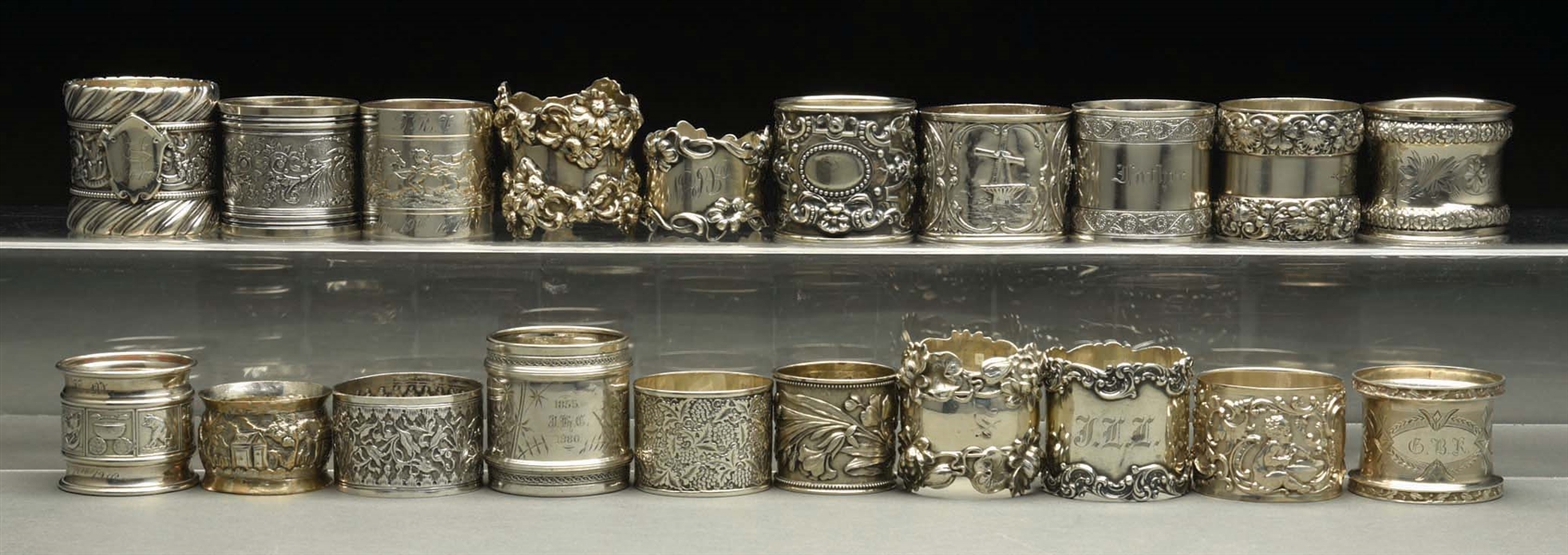 LOT OF 20: STERLING SILVER NAPKIN RINGS. 
