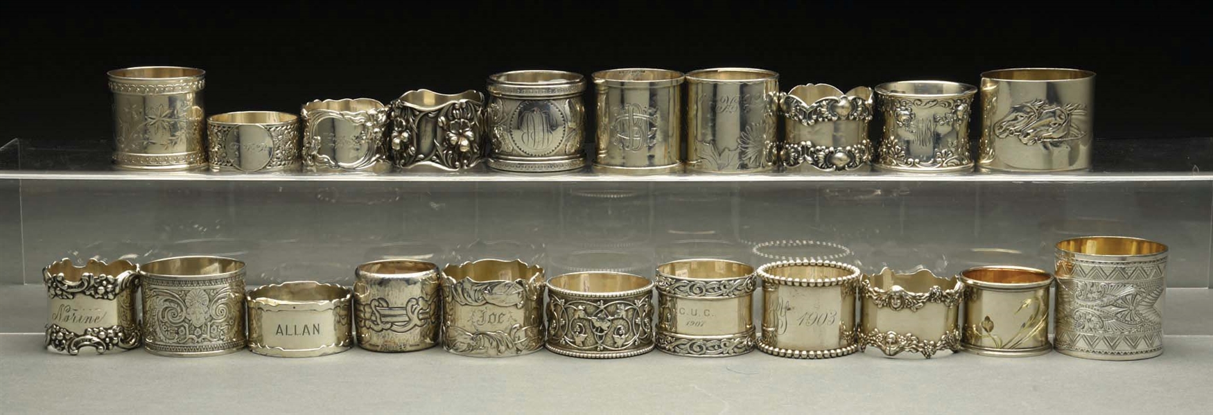 LOT OF 21: STERLING SILVER NAPKIN RINGS. 