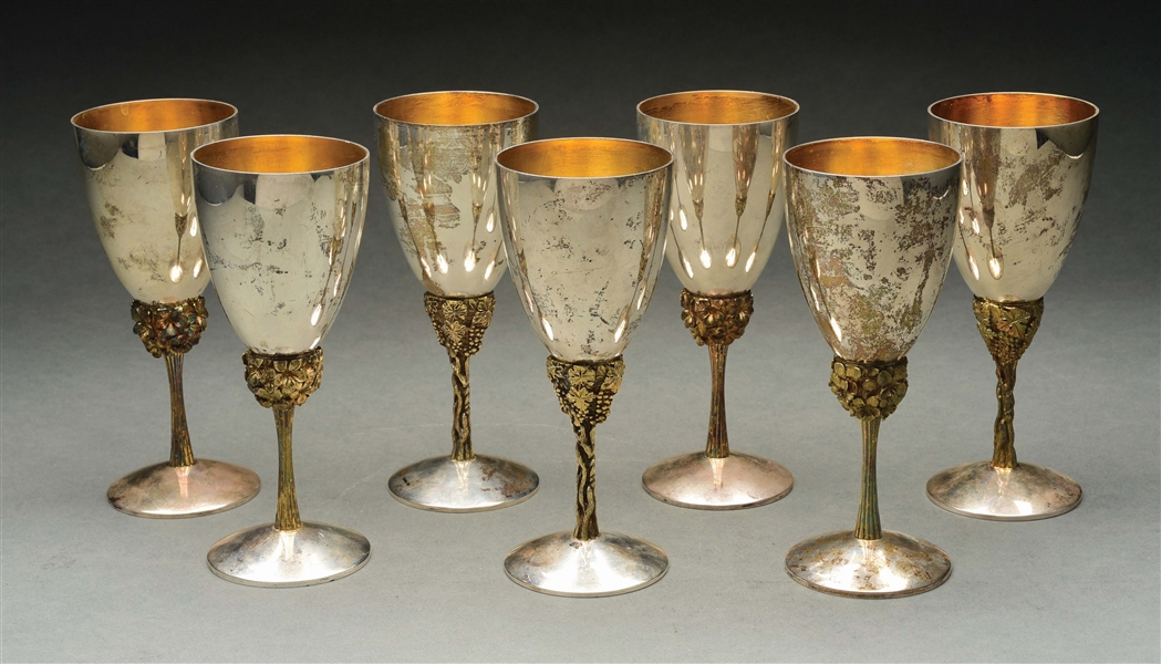 A SET OF FOUR ENGLISH SILVER GOBLETS AND THREE OTHERS.