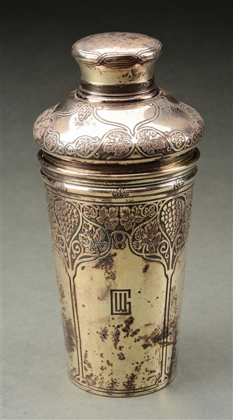 A TIFFANY STERLING COCKTAIL SHAKER.