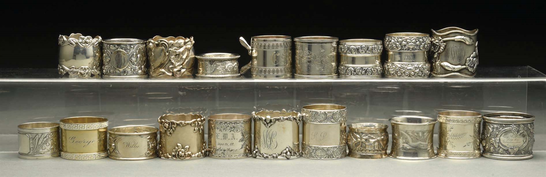 LOT OF 20: STERLING SILVER NAPKIN RINGS. 