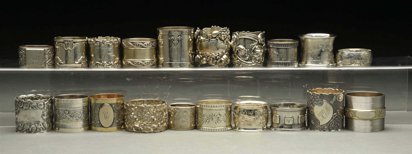 LOT OF 20: STERLING SILVER NAPKIN RINGS.
