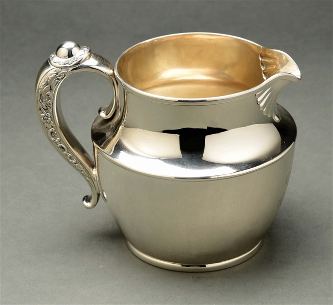 A TIFFANY STERLING WATER PITCHER.
