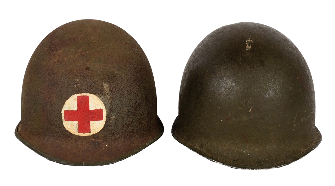 LOT OF TWO WORLD WAR II HELMETS WITH LINERS: M1 FIXED BALE HELMET WITH PAINTED MEDICAL CROSS AND MCCORD FIXED BALE HELMET 