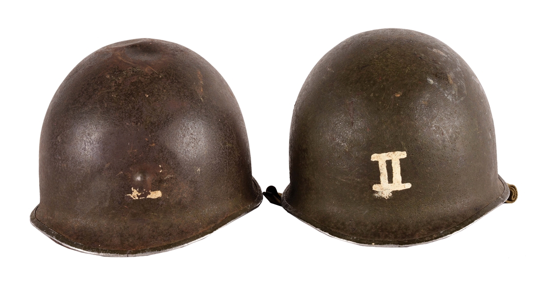LOT OF TWO WORLD WAR II US ARMY M1 FRONT SEAM FIXED BALE HELMETS WITH PAINTED INSIGNIA