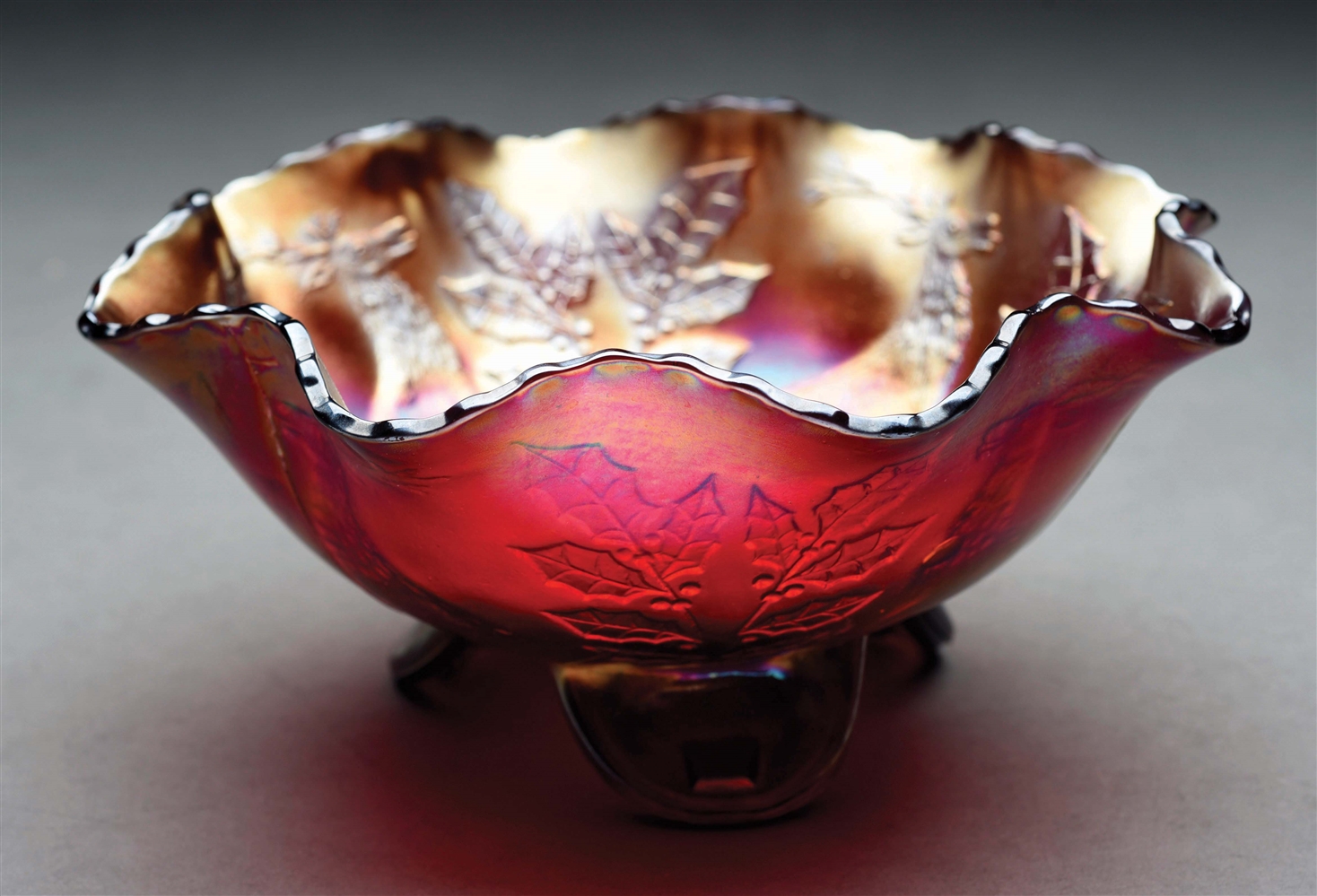 STAG AND HOLLY RED SPATULA-FOOTED BOWL.
