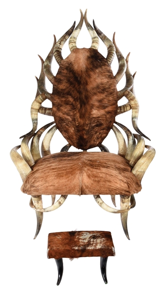LARGE HORNED CHAIR WITH FOOTSTOOL.