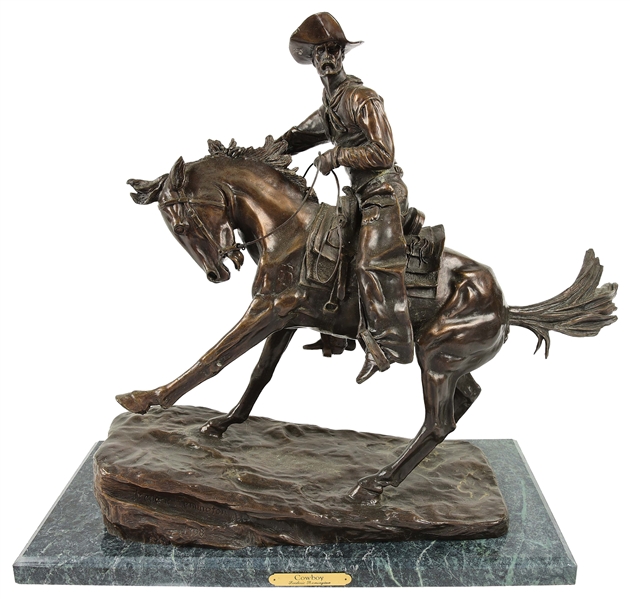 "THE COWBOY" BRONZE AFTER FREDERIC REMINGTON WITH DETACHED MARBLE BASE.